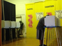 A voter casts his ballot Saturday at Daniel Webster Elementary for the Dallas City Council District 3 runoff between Casey Thomas and Joe Tave.