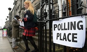 A young woman outside a polling station.