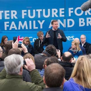 Image: Prime Minister David Cameron talks to supporters on April 4