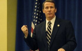 Ohio Secretary of State Jon Husted provides an overview of voting initiatives at a legislative preview forum hosted by The Associated Press on Thursday, Jan. 30, 2014, in Columbus, Ohio. Husted said it is easy to vote in Ohio and difficult to cheat. (